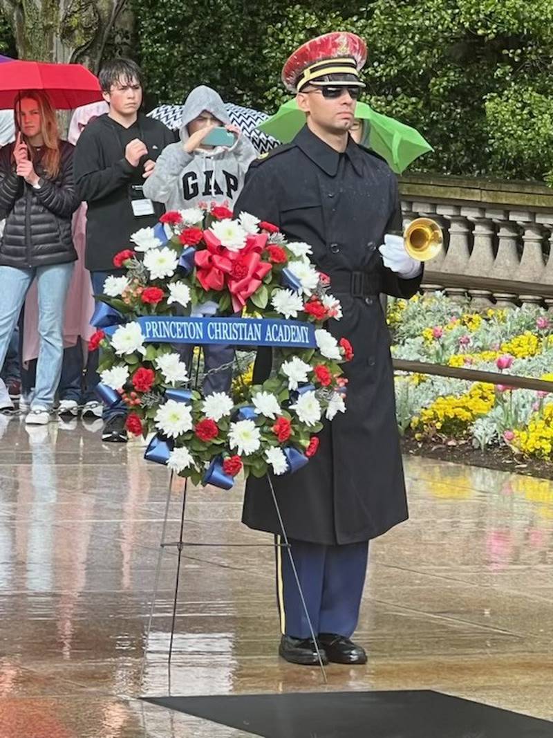 An Honor Guard stands by the wreath presented by Princeton Christian Academy in the wreath laying ceremony at the Tomb of the Unknown Soldier at Arlington National Cemetery on Thursday.