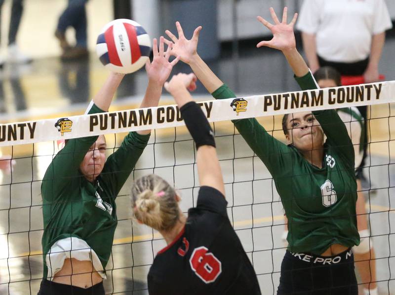 St. Bede's Lila Koehler makes a stop with the help from teammate Kijah Lucas during the Class 1A Regional semifinals on Wednesday, Oct. 29, 2025 at Putnam County High School.