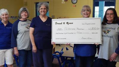 DeKalb women’s chorus donates check to Sycamore preschool
