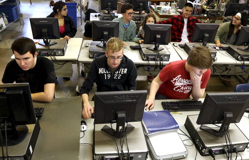 Woodstock High School web design students work on projects during class on Wednesday, Feb. 25, 2015. The number of high school students enrolled in one of three High School Plus programs at McHenry County College was up 31.3 percent last year compared to the year before, much of the growth over the last five years has occurred within the college's College in High School program.