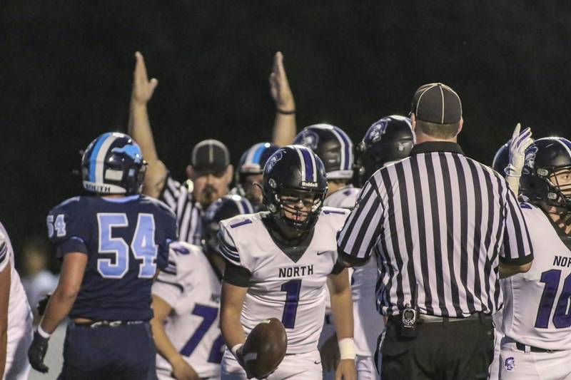 Downers Grove North's Owen Lansu (1) runs off the field after running in a touchdown during football game between Downers Grove North at Downers Grove South Friday, Sept 5, 2025  in Downers Grove.