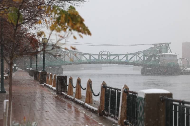 Snow falls on the Des Plaines River along Bicentennial Park in Joliet on Thursday, Nov. 21, 2024.