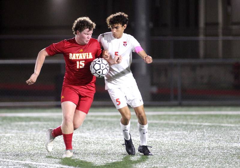 Batavia’s Brokk Olberg (left) and Oswego’s Benjamin Sobecki battle for control of the ball during a game at Batavia on Thursday, Sept. 7, 2023.