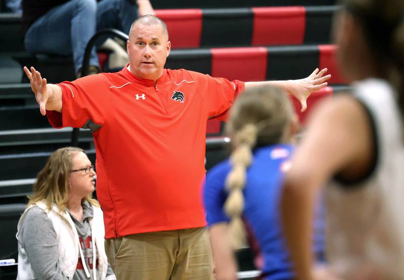 Indian Creek head basketball coach Paul Muchmore talks to a player Monday, Dec. 8, 2025, during their game against Genoa-Kingston at Indian Creek High School in Shabbona.