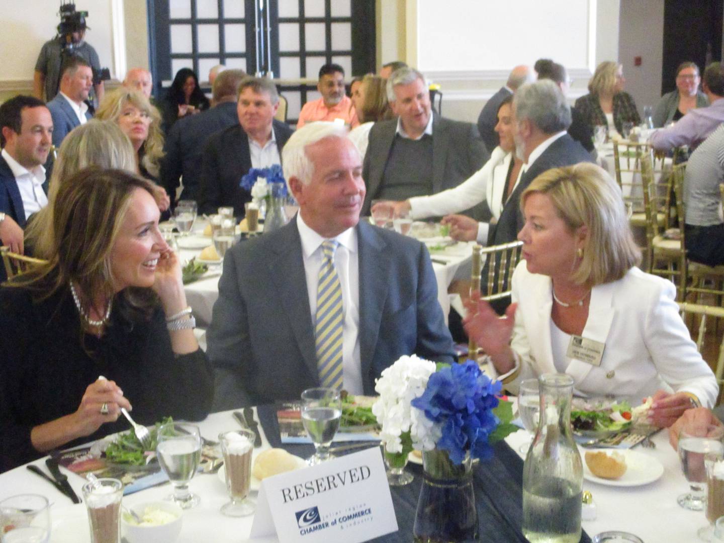 Mayor Terry D'Arcy (center) and his wife Sue (left) talk with Jen Howard, president of the Joliet Region Chamber of Commerce & Industry before the mayor's State of the City address on Wednesday. May 28, 2025