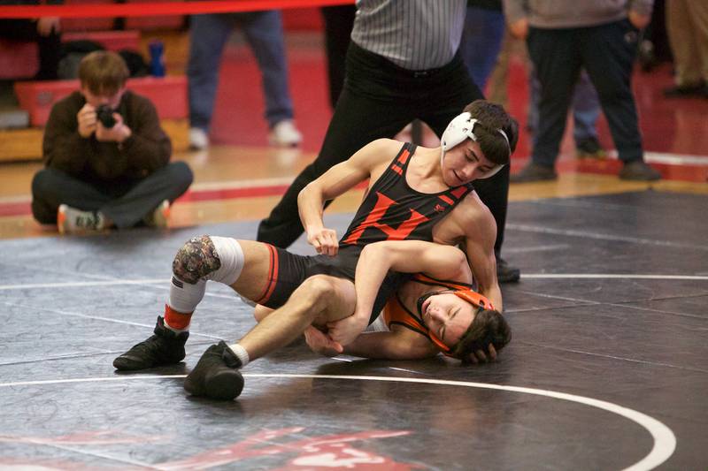 Huntley's Adam Pena competes against Hersey's Maksim Mukhamedaliyev  in the 126 lb 3rd place match at the Class 3A Sectional at Barrington High School on Saturday, Feb. 11, 2023.