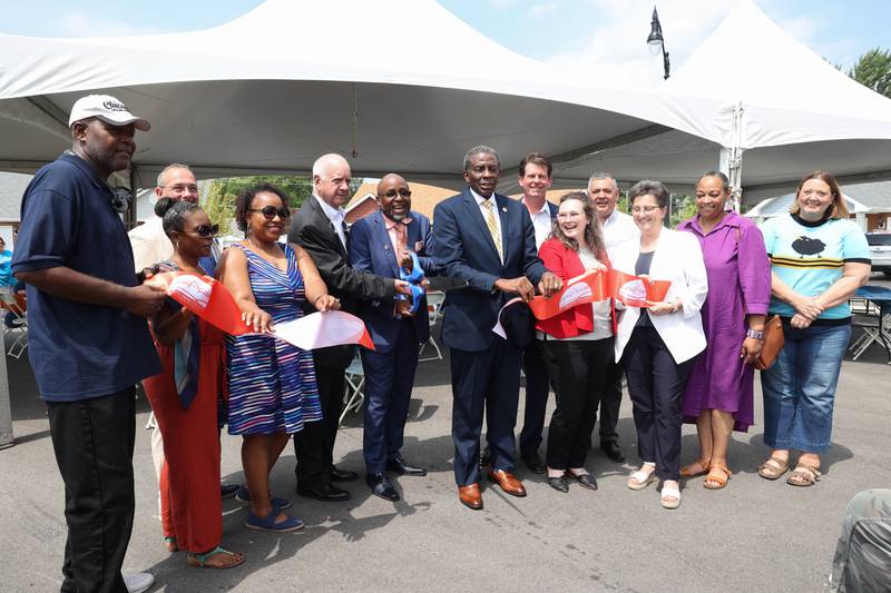 City and local officials stand with Kankakee County Housing Authority board members and staff to officially cut the Kankakee Chamber of Commerce ribbon during the West Harbor Residences ribbon cutting and street dedication ceremony on Wednesday, July 23, 2025.