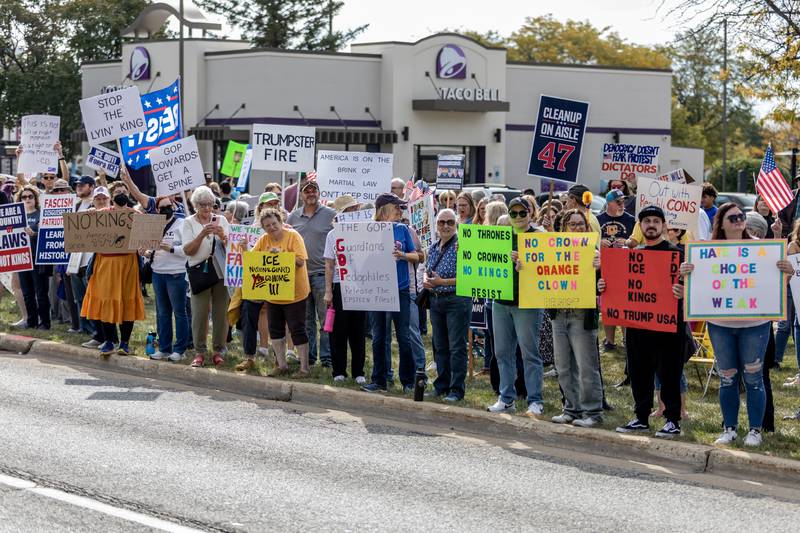 Protestors line Plainfield Road in Joliet during the No Kings Protest in Joliet on Oct. 18, 2025.