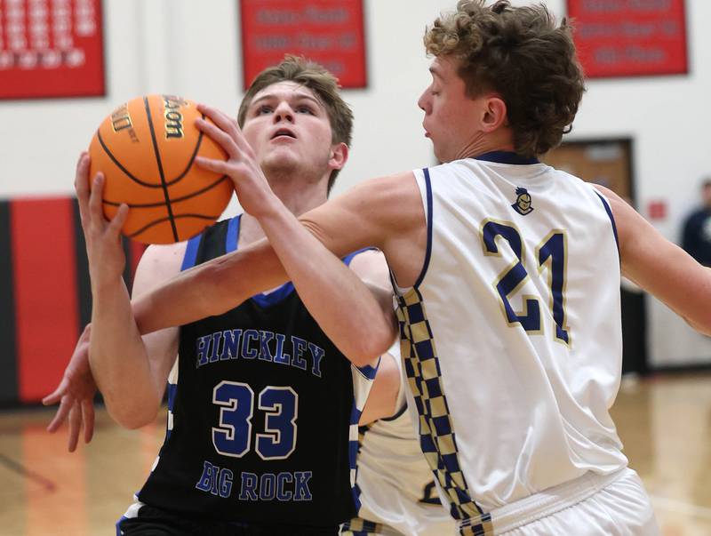 Hinckley-Big Rock's Marshall  Ledbetter is fouled by Marquette's Lucas Craig Tuesday, March 3, 2026, during their sectional semifinal matchup at Amboy High School.