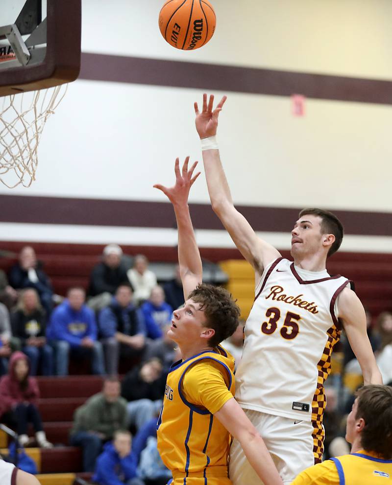 Richmond-Burton's Jace Nelson shoots the ball over Johnsburg's Josh Kaunas during a Kishwaukee River Conference boys basketball game on Tuesday, Jan. 27, 2026, at Richmond-Burton High School.