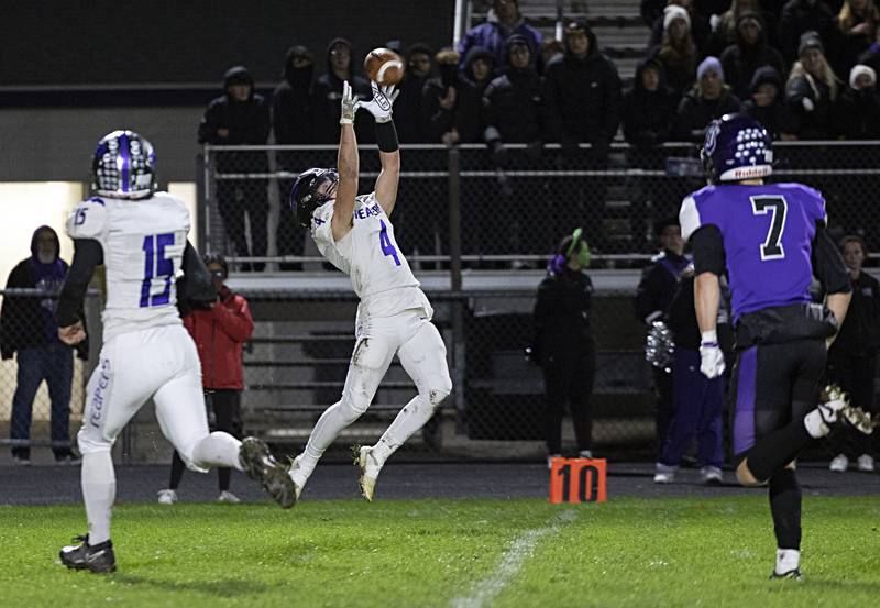 Plano’s Noah Uhrich hauls in a pass for a big gain against Dixon Friday, Oct. 27, 2023 in Dixon.