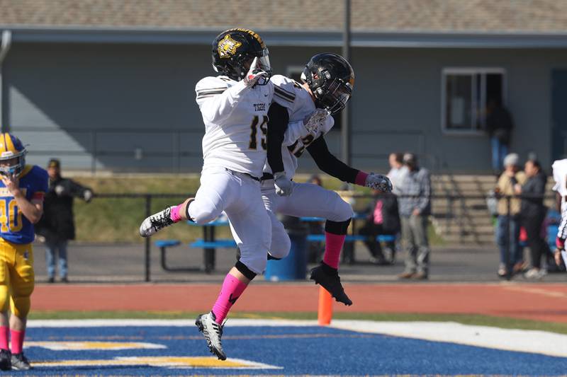 Joliet West’s Carl Bartolo (15) celebrates with Dylan Pangrazio (12) after Dylan’s block resulted in a safety against Joliet Central on Saturday.