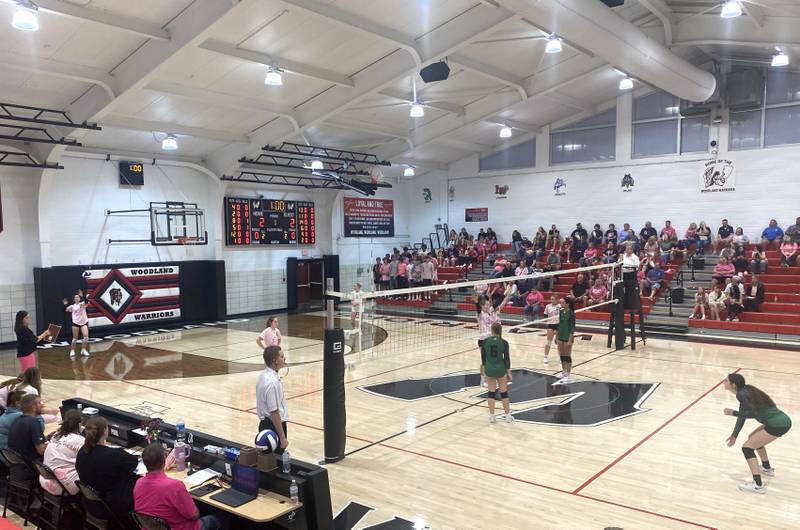 Woodland's Addy Ewing (2, at far left) readies a serve to the Leland side of the net Wednesday, Oct. 1, 2025, at the Warrior Dome in rural Streator.
