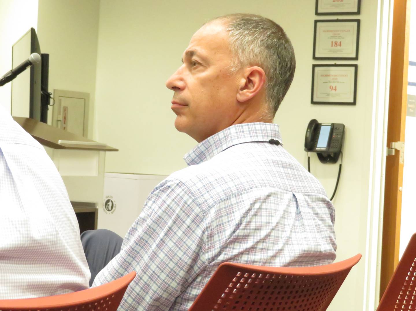 Jerry Krusinski, chief executive officer of Krusinski Construction Company, listens during the Monday, July 26, 2021 DeKalb City Council meeting at DeKalb Public Library.