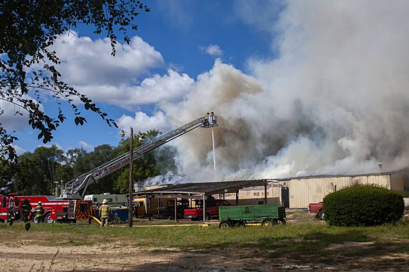 Firefighters battle a blaze at the 300 block of Cropsey avenue in Dixon on Monday, Sept. 26, 2022. Breaking out at Auction City, responders from Dixon, Rock Falls, Polo, Sterling, Amboy, Oregon and Mt. Morris responded to the the alarms.