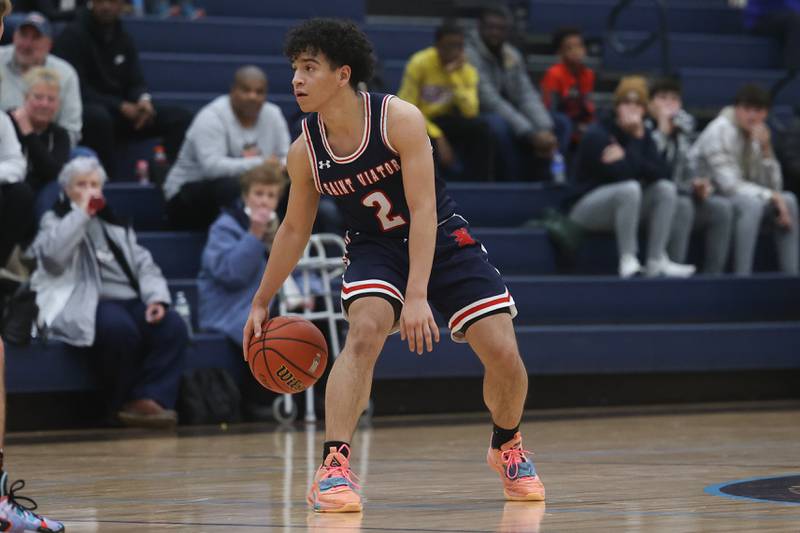 St. Viator’s Joey Hernandez works the ball against Joliet Catholic.