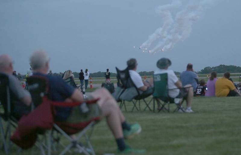 A crowd watches the Titan Aerobatic Team during the 10th annual TBM Avenger Reunion and Airshow on Friday, May 16, 2025 at the Illinois Valley Regional Airport in Peru.