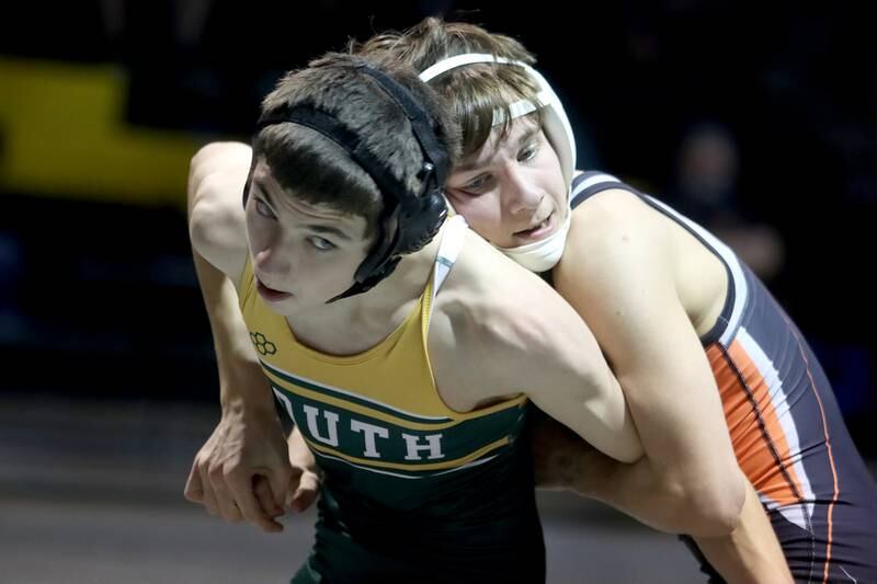 Crystal Lake South’s Glen Donahue, left, battles McHenry’s Lucas Van Diepen in a 120-pound match during varsity wrestling at Crystal Lake Thursday night.