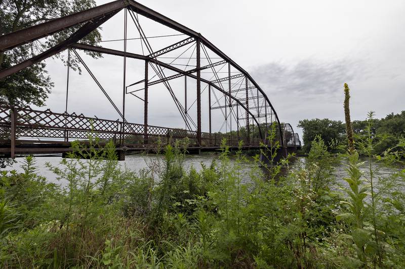 The historic Lyndon bridge is seen Thursday, July 30, 2025, spanning the Rock River. Closed in 1980, the village continues to sell plank repairs for a $100 donation with a name plate being dedicated to the donor.