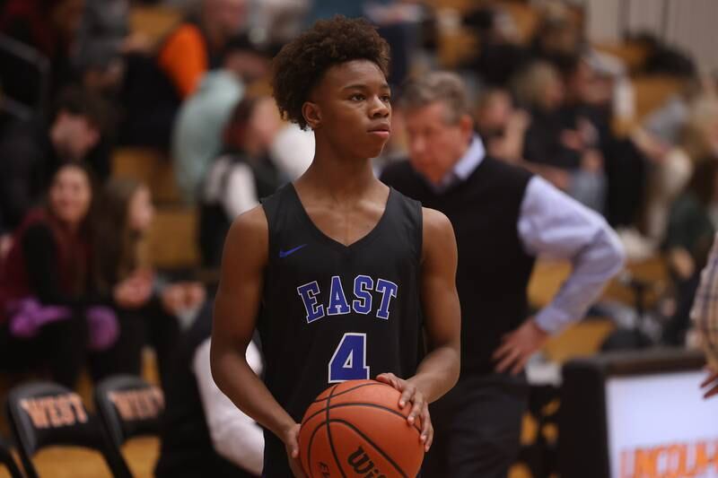 Lincoln-Way East’s BJ Powell warms up at halftime against Lincoln-Way West.
