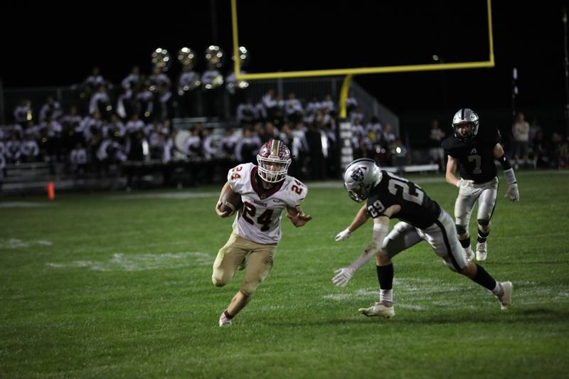 Morris' Ashton Yard (left) finds open field Friday in a 49-35 win over Kaneland. Yard ran for 352 yards and three touchdowns.