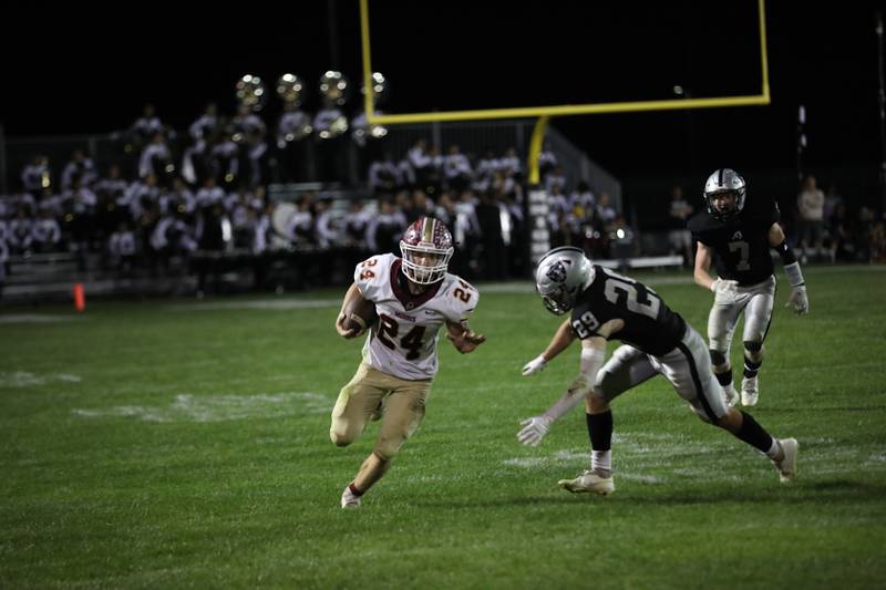 Morris' Ashton Yard (left) finds open field Friday in a 49-35 win over Kaneland. Yard ran for 352 yards and three touchdowns.