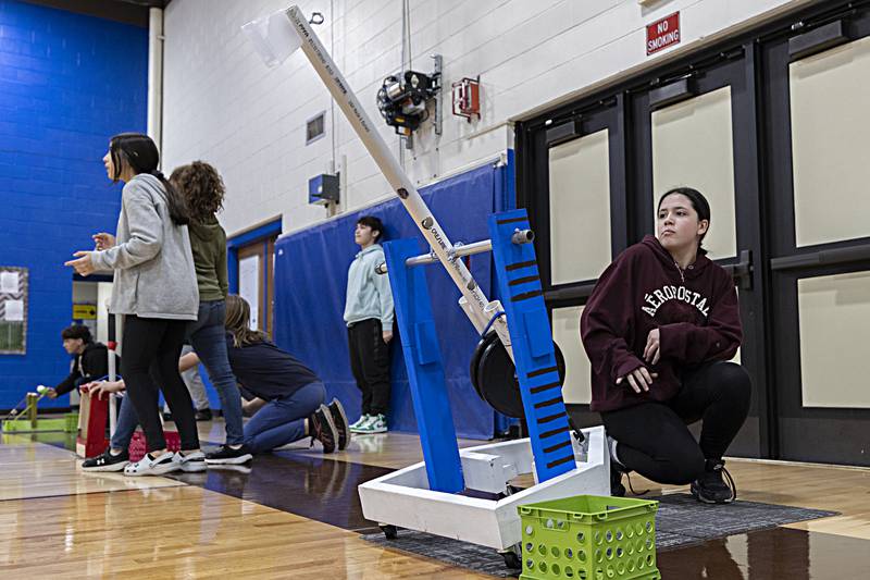 Sixth grader Saree Rodriguez fires off the last of three shots Friday, Dec. 15, 2023 from the catapult built by her, Sana Tefiku and Amaya Hendrix.