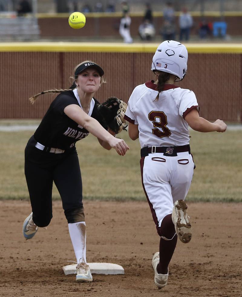 Prairie Ridge's Ady Kiddy turns a double play as Richmond-Burton’s Jocelyn Hird runs into the base during a nonconference softball game on Tuesday, March 18, 2025, at Richmond-Burton High School.