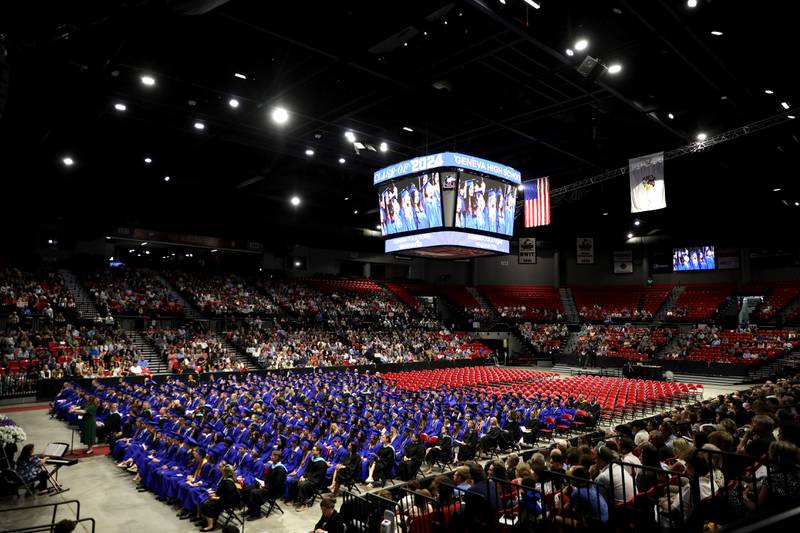 The Geneva High School choir performs during the 2024 commencement ceremony at Northern Illinois University in DeKalb on Tuesday, May 28, 2024.