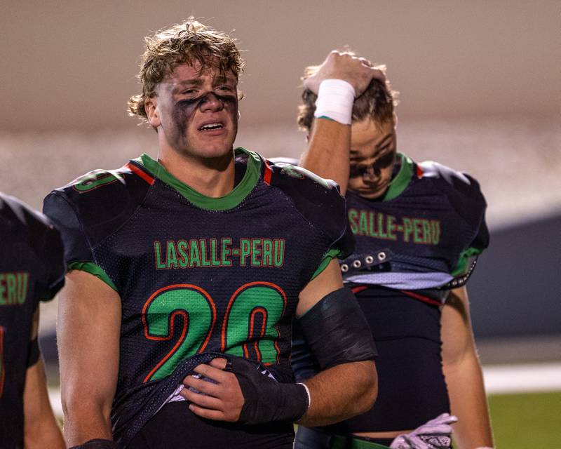 Griffin May (20) of L-P gets emotional after loss to O' Fallon on Friday, October 24, 2025 at Howard Fellows Stadium in LaSalle.