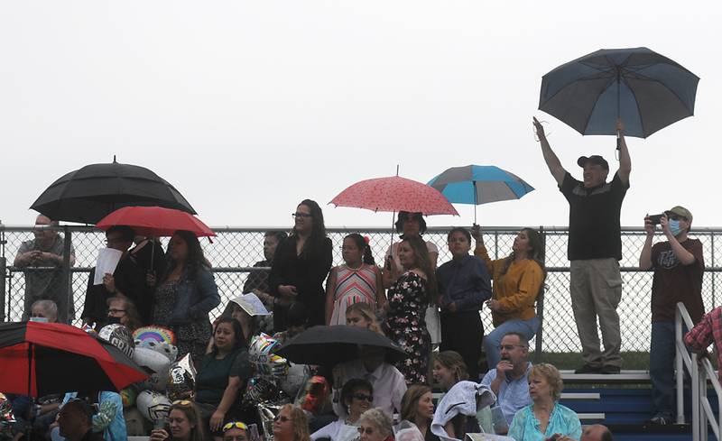 People cheer for graduates Sunday, May 15, 2022, during the Woodstock High School graduation ceremony in Woodstock.