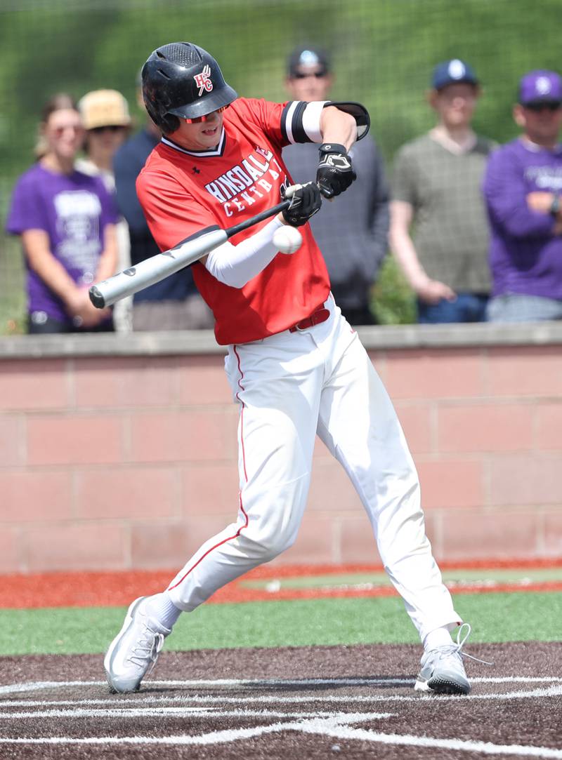 Hinsdale Central's Benjamin Oosterbaan (12) makes contact with the ball during the IHSA Class 4A baseball regional final between Downers Grove North and Hinsdale Central at Bolingbrook High School on Saturday, May 27, 2023.