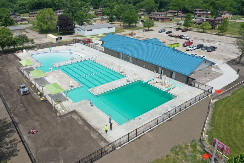 Workers fill Riordan Pool on Tuesday, June 13, 2023 in Ottawa. The pool will open June 19 to the public. The construction of the 6.7 million dollar pool began in September of 2022. The facility includes a 9,700 square foot pool, complete with a zero foot entry, six 70-foot competition lanes and three diving stands, plus a 5,700 square foot building containing private family changing rooms, locker rooms, showers, restrooms and offices.
There will be a shelter with picnic tables, vending machines and tables for umbrellas.