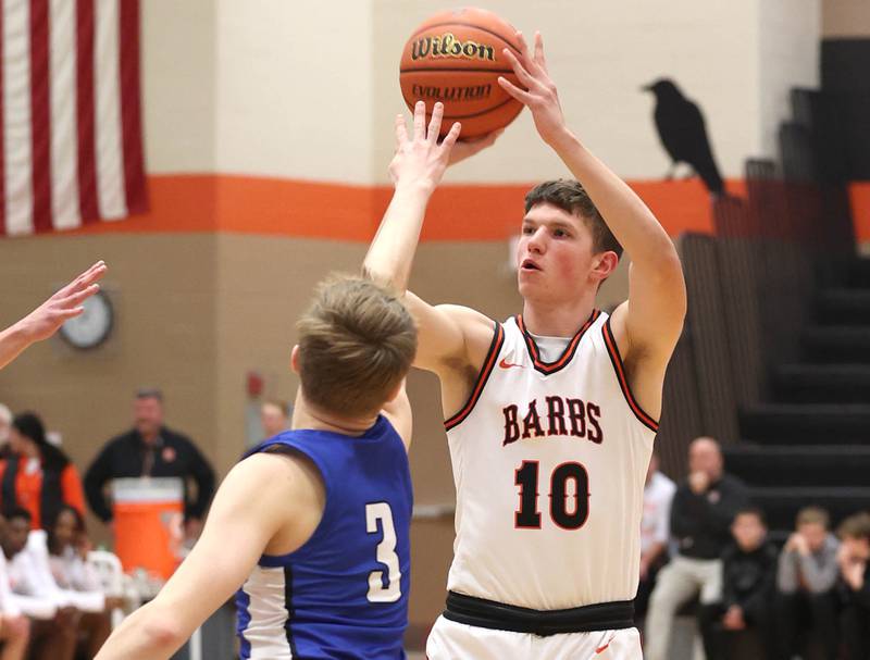 DeKalb’s Eric Rosenow shoots over Geneva’s Elliot Kroeyr Thursday Dec. 28, 2023, during their second round game in the 96th Chuck Dayton Classic boys basketball tournament at DeKalb High School.