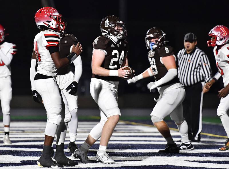 Joliet Catholic's Larry Stringham (24) reacts after scoring a touchdown during the IHSA Class 5A first round playoff game against Jacksonville on Saturday, Nov 02, 2024 at Joliet. (Dean Reid for Shaw Local News)