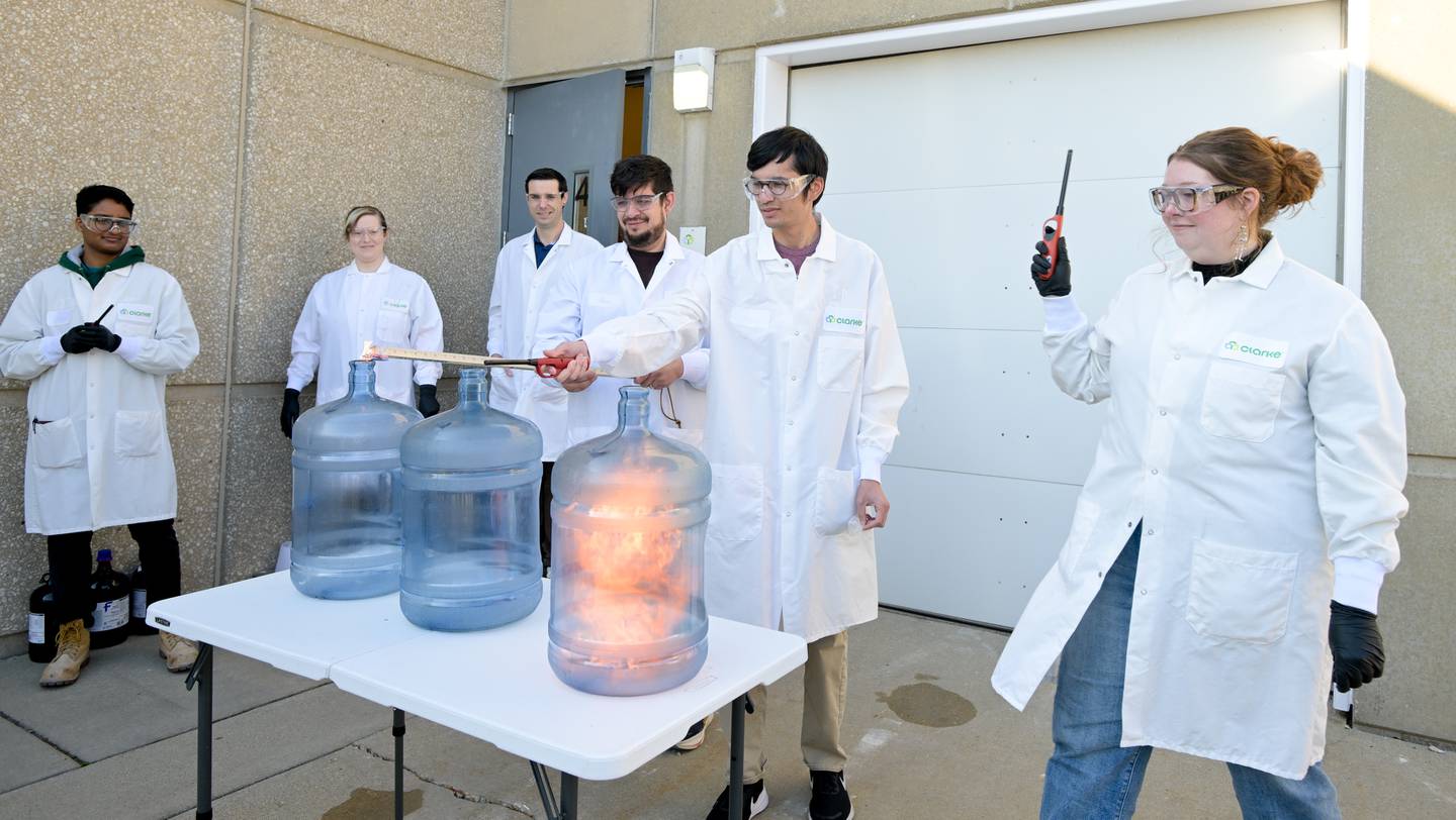 Several scientist from Clarke Mosquito Control and Management in St Charles run a alcohol flammability experiment for students from St. Charles North High School during an industrial tour on Thursday, Oct 16, 2025.