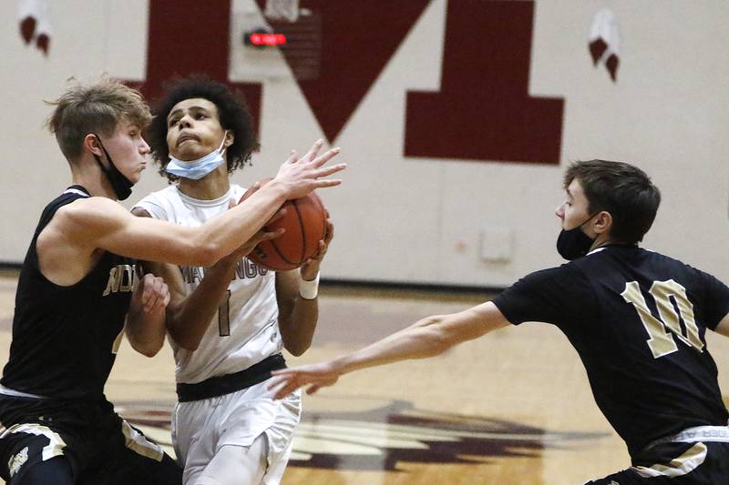 Marengo's Exzavier Meyer draws a foul from Grayslake North's Dominic Jankowski during their EC Nichols Holiday Tournament boys basketball game on Monday, Dec. 20, 2021 at Marengo Community Unit High School in Marengo.