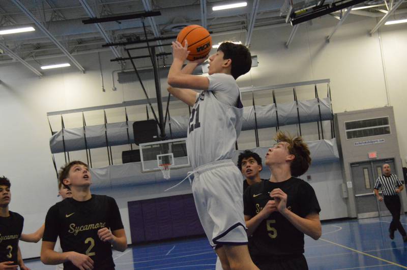Rochelle's Elliot Kessen hits a 3-pointer during the Hubs' sophomore game with Sycamore.