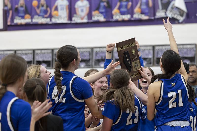 Geneva celebrates their 49-40 win over Dixon Thursday, Feb. 19, 2026, in the Class 3A girls basketball regional title game.