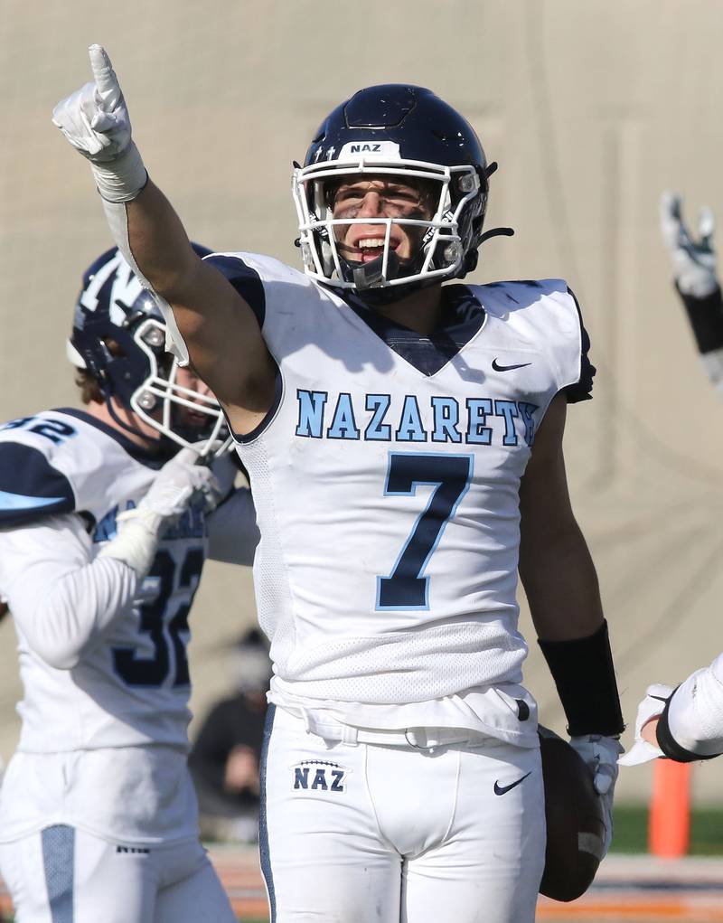 Nazareth's Zach Hayes celebrates his game sealing interception during their IHSA Class 5A state championship win over Peoria Saturday, Nov. 26, 2022, in Memorial Stadium at the University of Illinois in Champaign.