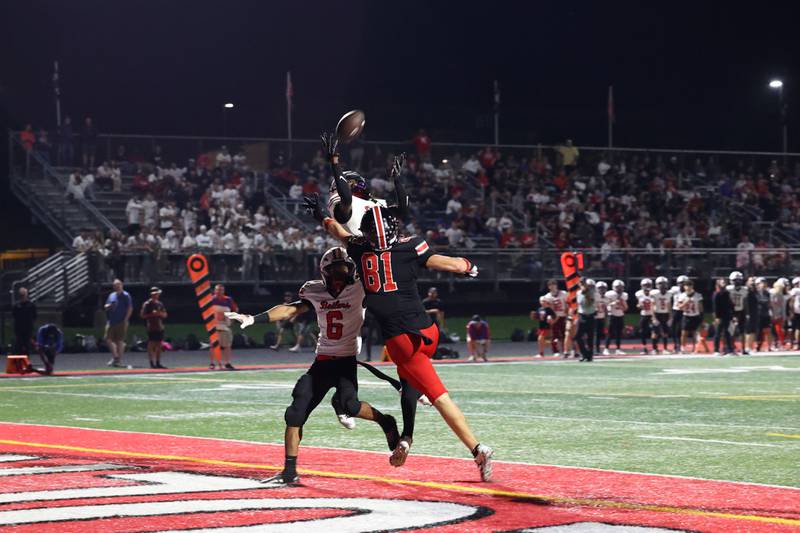 Bradley-Bourbonnais' Lyzale Edmon nearly catches a touchdown pass alongside teammate Rontez Smith and under pressure from Lincoln-Way Central's Lucas Andresen during the Knight's 28-20 victory over Bradley-Bourbonnais on Friday, Oct. 3, 2025.