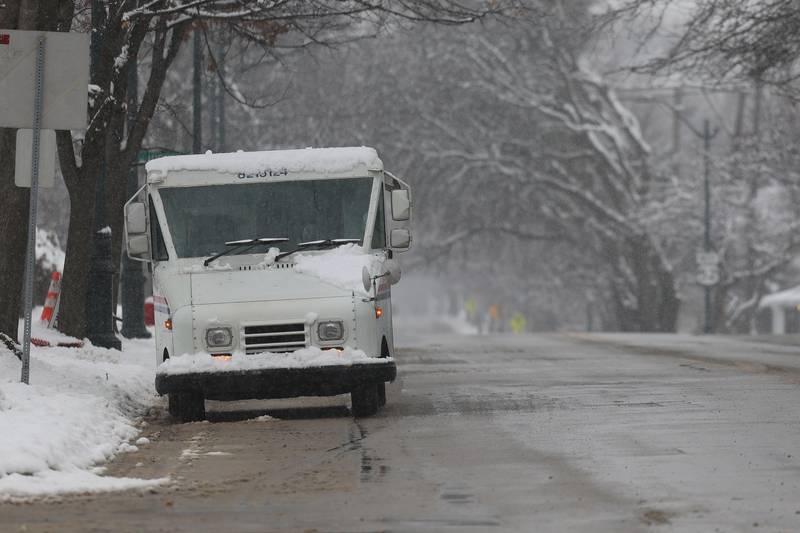 A mail truck makes its round along North Raynor Avenue in Joliet on Wednesday January 25th, 2023.