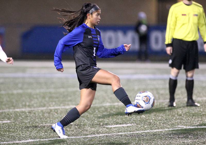 Geneva’s Rilee Hasegawa gets control of the ball during a home game against Lyons Township on Thursday, March 24, 2022.