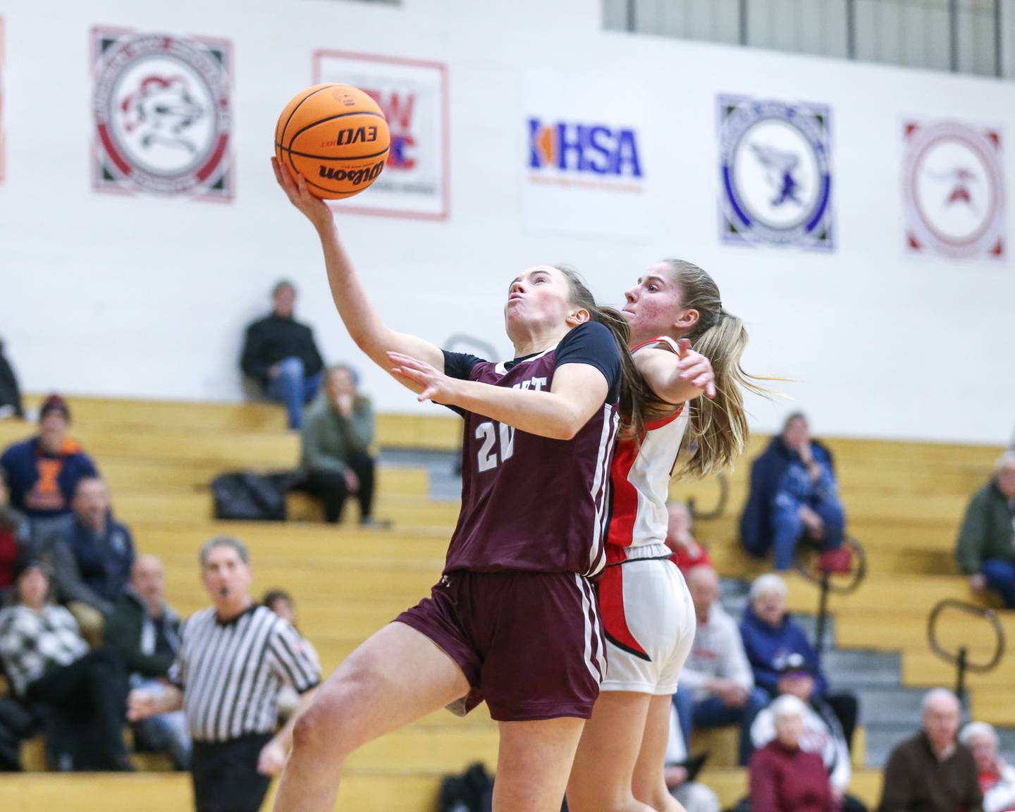 Lockport's Lucy Hynes (20) puts in a layup during their basketball game between Lockport at Lincoln-Way Central. Jan 21, 2025 in New Lenox.