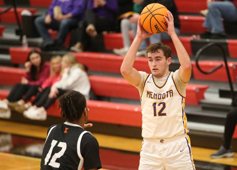 Mendota's Braiden Freeman looks to pass the ball around Kewanee's Brayden Conley during the 50th annual Colmone Classic on Thursday, Dec. 12, 2024 at Hall High School.