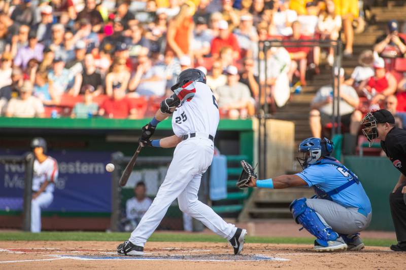 Designated hitter Dylan Busby (25) hits a ball during a game against the Lake Country DockHounds at Northwestern Medicine Field on Saturday, July 2, 2022.