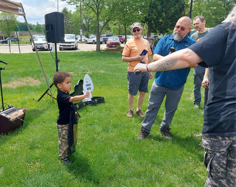 Luka Gutierrez, 3, of Elk Grove Village, shows off his award for the youngest Midwest Morel Fest participant on Saturday, May 4, 2024, in Ottawa.