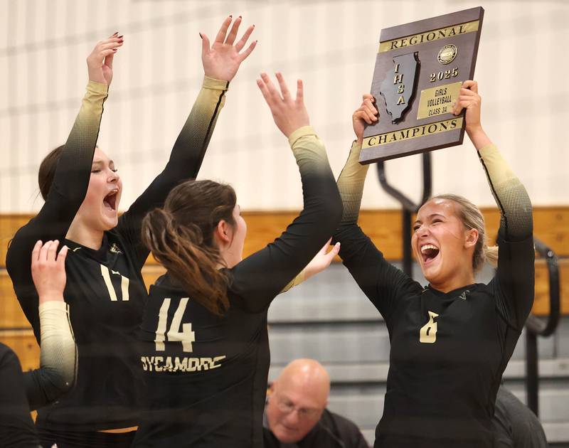Sycamore volleyball players celebrate their Class 3A regional championship win over Dixon on Thursday, Oct. 30, 2025, in Rochelle.