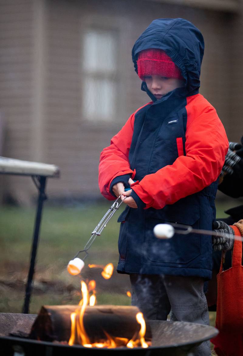 Sonnie Smith, 6, of Lisle roasts a marshmallow during the Downers Grove Museum’s Merry & Bright: A Victorian Christmas event on Saturday, Dec. 10, 2022.