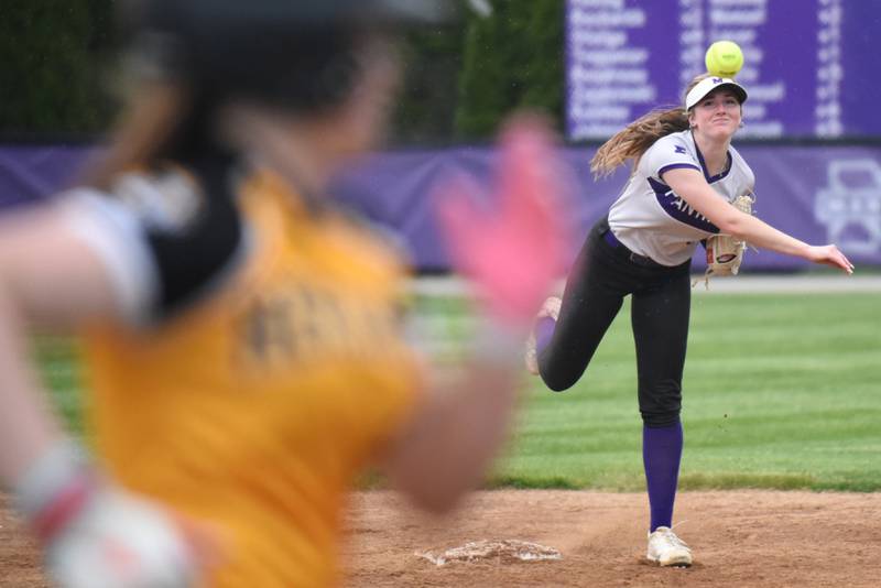 Manteno's Aubrie Goudreau throws to first as Herscher's Lily Tucek races down the line during a game at Manteno Tuesday, May 12, 2026.